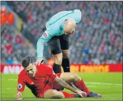  ?? Picture: GETTY IMAGES ?? MAN DOWN: Referee Anthony Taylor talks to Philippe Coutinho, of Liverpool, during the Premier League match against Sunderland