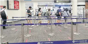  ?? PHANUMET TANRAKSA ?? People arrive on scheduled domestic flights at Chiang Mai airport yesterday. More flights and passengers are expected at the airport this month with the Covid-19 lockdown easing.