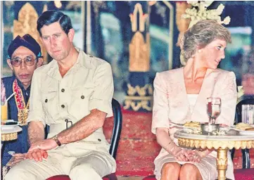  ??  ?? Charles and Diana watching Indonesian tribal dancers in Yogyakarta, Indonesia, on Nov 5, 1989. (Below) Prince Charles and his wife Camilla, in Florence, during a six-day visit to Italy and the Vatican. — AFP file photos