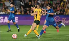  ?? Photograph: Dean Lewins/AAP ?? Hayley Raso of Australia scores her team’s second against Thailand at Central Coast Stadium in Gosford.