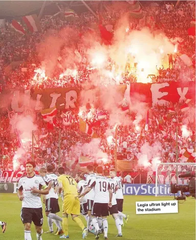  ??  ?? Legia ultras light up the stadium