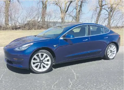  ??  ?? The Tesla Model 3 looks like a mashup of the Model S and the Model X three-row crossover.