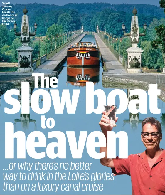  ??  ?? Salut! Jeremy Clarke toasts life on board a barge on the Briare Canal