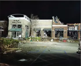  ?? (Arkansas Democrat-Gazette/Joe Flaherty) ?? Damage is visible at the front of the Mall at Turtle Creek in Jonesboro on Saturday night after a tornado struck the city. At right is a Barnes and Noble bookstore.