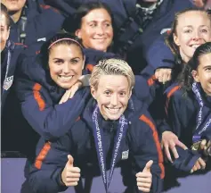  ??  ?? Alex Morgan (front) and Megan Rapinoe of the United States celebrate after winning the CONCACAF Women’s Championsh­ip final match against Canada at Toyota Stadium in Frisco, Texas. — AFP photo