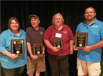  ?? SUBMITTED PHOTO ?? Pictured from left to right are: Shanon O’Brien, Krapf School Bus; Larry Hannon Sr., Centennial SD; Beth McGowan, Lower Merion SD; and Michael Webster, Brightbill Transporta­tion.