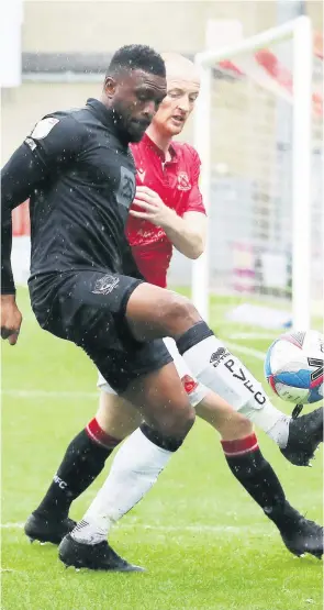  ??  ?? EYES ON THE BALL:
David Amoo in the thick of the action. Picture by Gerard Austin.