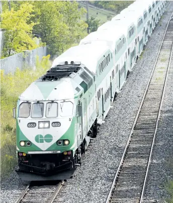  ?? BOB TYMCZYSZYN/STANDARD FILE PHOTO ?? A GO train passes under the bridge in Merritton as it makes way out of Niagara in September 2014.