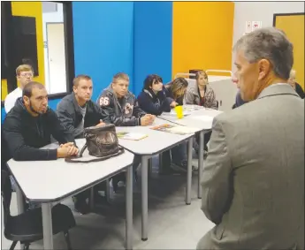  ?? TIMES photograph by Kent Marts ?? An employee of Walmart talked to Pea Ridge High School students about the huge variety of careers the Bentonvill­e-based offers in a classroom of PRMBA, Pea Ridge Manufactur­ing and Business Academy, a conversion charter school on the Pea Ridge High...