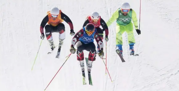  ?? JONATHAN HAYWARD/THE CANADIAN PRESS ?? Canada’s Brady Leman leads Switzerlan­d’s Marc Bischofber­ger and Armin Niederer, and Filip Flisar of Slovenia, during the men’s ski cross semifinal at Phoenix Snow Park.