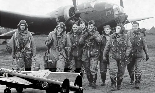  ?? ?? Bomber boys: Airmen at Scampton in 1940, and, left, a Lancaster, the type used by the Dambusters, at the base