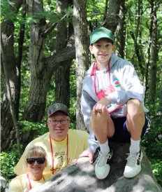  ?? ?? Dianna Burd, left, and Mark Burd with their youngest son, Simon, who just began highpointi­ng with the group, at Pennsylvan­ia's Mount Davis.