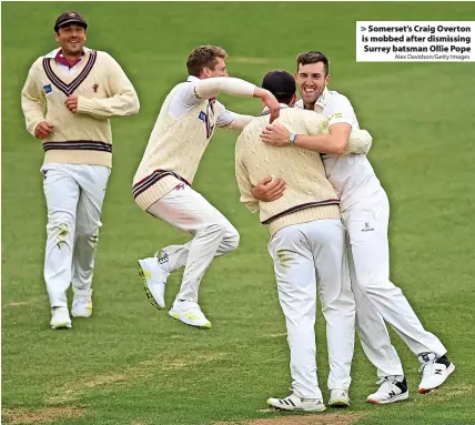  ?? Alex Davidson/Getty Images ?? > Somerset’s Craig Overton is mobbed after dismissing Surrey batsman Ollie Pope