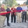  ?? KEVIN D. THOMPSON / THE PALM BEACH POST ?? Mayor Pam Triolo (center) and commission­ers cut the ribbon Tuesday for the project.