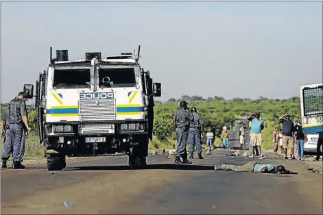  ?? PHOTO: MOELETSI MABE ?? POLICE BRUTALITY? Mothutlung resident Lerato Seema lies bleeding on the road with serious head injuries after allegedly being thrown from a fast-moving police Nyala during water protests in the area last year