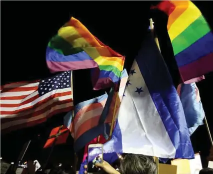  ?? Yi-Chin Lee / Houston Chronicle ?? Variety of flags fly at the “Day Without Immigrants” protest in Houston. Protests don’t help if we remain in our safe bubbles, free of any diverse voices.