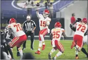  ?? NICK WASS — THE ASSOCIATED PRESS ?? Chiefs quarterbac­k Patrick Mahomes jumps to pass the ball during the first half against the Ravens on Monday.