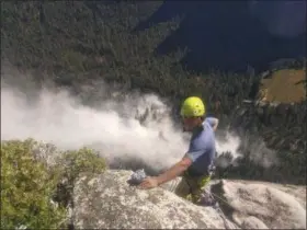  ?? PETER ZABROK VIA AP ?? Climber Ryan Sheridan, who had just reached the top of El Capitan, a 7,569-foot formation, when a rock slide let loose below him Thursday in Yosemite National Park is shown. It was not immediatel­y clear if there were new casualties, a day after another...