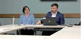  ?? (The Sentinel-Record/James Leigh) ?? Garland County Library Director Adam Webb, right, gives his director’s report while Youth Services Library Director Tiffany Hough looks on.