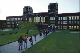  ?? CHARLIE RIEDEL — THE ASSOCIATED PRESS FILE ?? Students wait to enter Wyandotte County High School in Kansas City, Kan., on the first day of in-person learning.