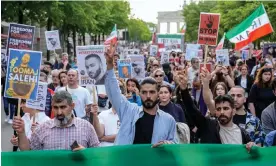  ?? Photograph: Ebrahim Noroozi/AP ?? A rally in Berlin on 28 April protesting against the death sentence given to Toomaj Salehi.