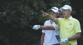  ?? Dave Thompson / Associated Press ?? Jordan Spieth (right) and Justin Thomas play a British Open practice round at Royal Birkdale. Spieth is coming off his second victory of the year last month at the Travelers Championsh­ip.