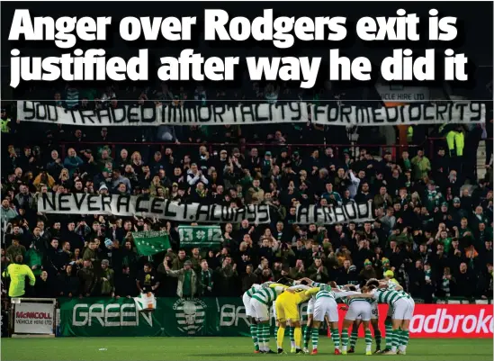  ??  ?? Celtic supporters let Brendan Rodgers know what they think at Tynecastle – ‘You traded immortalit­y for mediocrity. Never a Celt, always a fraud’