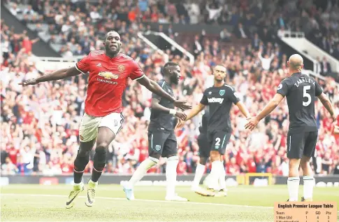  ?? AP ?? Manchester United’s Romelu Lukaku (left) celebrates scoring his side’s second goal of the game during the English Premier League football match between Manchester United and West Ham United at Old Trafford in Manchester, England, yesterday.