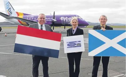  ??  ?? Promoting the new flights to Amsterdam, below, are airport manager Derrick Lang, left, customer services supervisor Arlene MacRae and Councillor Ken Guild.