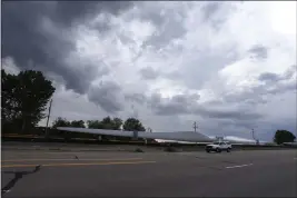  ?? BRENNAN LINSLEY — THE ASSOCIATED PRESS ?? A train carries blades for wind turbines through Rocky Ford, Colorado. Under new criteria from the U.S. Census Bureau, Rocky Ford will no longer qualify as an “urban” area.