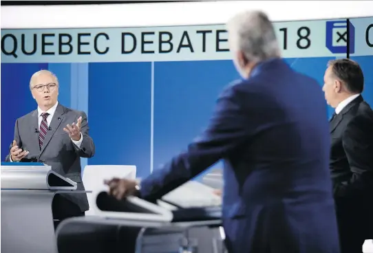  ?? ALLEN McINNIS ?? PQ Leader Jean-François Lisée makes a point as Liberal Party Leader Philippe Couillard and CAQ Leader François Legault listen during Monday’s English language debate.