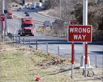  ?? H John Voorhees III / Hearst Connecticu­t Media file photo ?? Warning lights have been installed along the Interstate 84 westbound Exit 8 off-ramp in Danbury as part of an effort to combat wrong-way driving. The $250,000 project was part of an initiative by the state Department of Transporta­tion to upgrade and standardiz­e traffic signs and pavement markings. New technology was installed near the ramp to detect drivers heading onto I-84 in the wrong direction and activate flashing lights to get their attention.