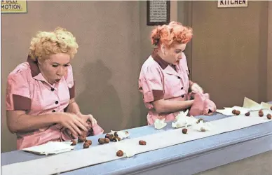  ??  ?? Ethel (Vivian Vance) and Lucy (Lucille Ball) find a job as chocolatie­rs in an “I Love Lucy” episode called “Job Switching.”
