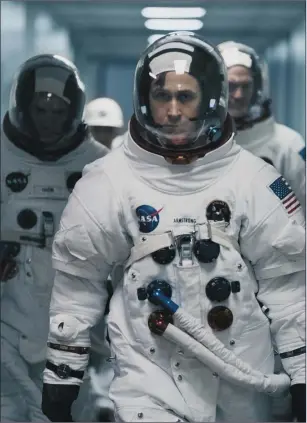  ??  ?? Lukas Haas as Michael Collins, Ryan Gosling as Neil Armstrong and Corey Stoll as Buzz Aldrin in First Man.