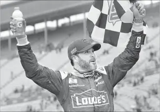  ?? Brian Lawdermilk Getty Images ?? JIMMIE JOHNSON CELEBRATES after winning the Food City 500 at Bristol Motor Motor Speedway on Sunday. It was his 82nd career victory.