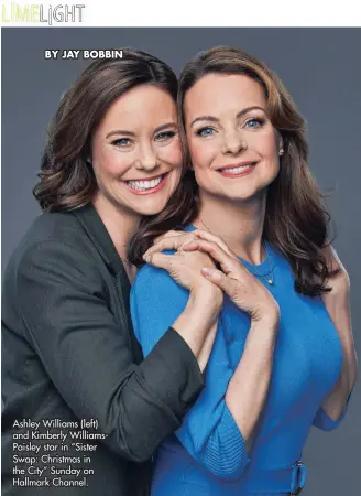  ?? ?? Ashley Williams (left) and Kimberly WilliamsPa­isley star in “Sister Swap: Christmas in the City” Sunday on Hallmark Channel.