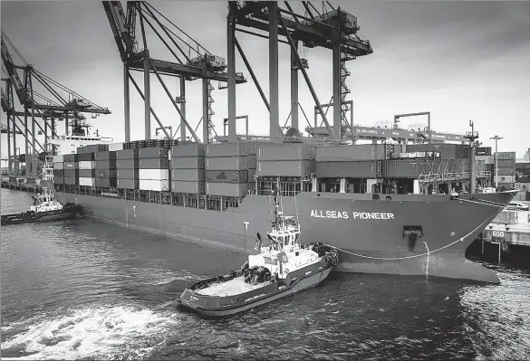  ?? PROVIDED TO CHINA DAILY ?? Allseas Pioneer, a container ship carrying 1,631 containers of Chinese goods, sits at dock in the Port of Liverpool, the United Kingdom, on Friday. It is the first own-branded vessel to use the direct shipping route known as China Xpress — operated by British company Allseas Global Logistics.