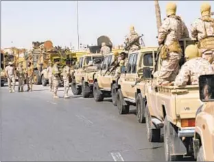  ?? ?? Forces loyal to Abdul Hamid Dbeibah, one of Libya’s two rival prime ministers, secure the streets of the capital, Tripoli, last month. But fighting flared again over the weekend.