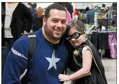  ?? FILE PHOTO ?? A father dressed as Captain America and his daughter dressed as Batgirl visit The Great Philadelph­ia Comic Con! at the Greater Philadelph­ia Expo Center in Oaks, in 2015.