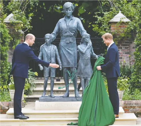  ?? DOMINIC LIPINSKI / POOL PHOTO VIA THE ASSOCIATED PRESS ?? Prince William, left, and Prince Harry unveil a statue they commission­ed of their mother Princess Diana on what would have been her 60th birthday.