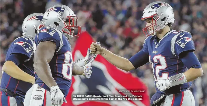  ?? STAFF PHOTO BY NANCY LANE ?? ON THEIR GAME: Quarterbac­k Tom Brady and the Patriots offense have been among the best in the NFL this season.
