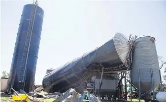  ?? AP ?? A tornado that passed through New Jersey last week toppled silos at Wellacrest Farms, the state’s largest dairy farm. The remnants of Hurricane Ida dumped record rain over in the U.S. Northeast.