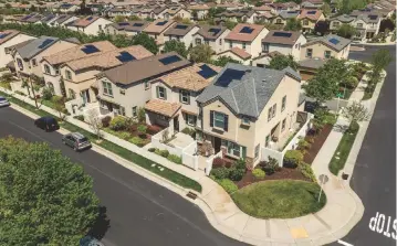  ?? Scott Lorenzo ?? Front yards and patios are appealing fixtures in Westpark, as driveways are in the back of homes.