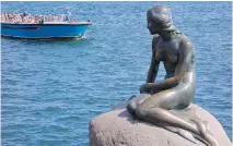  ??  ?? A boat cruise along Copenhagen’s harbourfro­nt provides views of the city — and of the iconic Little Mermaid statue.