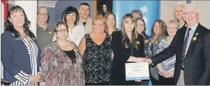  ?? SUBMITTED PHOTO ?? The Cavendish Farms’ Fryin for a Cure Relay team from Prince County was presented with the Relay For Life Community Spirit Award by Lt.-Gov. Frank Lewis (right) and Marlene Mulligan, (left) executive director, Canadian Cancer Society, P.E.I.