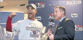  ?? ELSA GARRISON — GETTY VIA AP, POOL ?? Boston Red Sox manager Alex Cora, left, celebrates in the clubhouse Thursday after the Red Sox defeated the Houston Astros 4-1 to win baseball’s American League Championsh­ip Series. The Red Sox head to the World Series, which begins Tuesday on Fox.