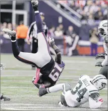  ?? CHARLES KRUPA / ASSOCIATED PRESS ?? New England wide receiver Brandon LaFell gets upended by New York safety Dion Bailey during the second half. The newly activated LaFell had just two catches and several drops.