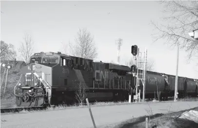  ?? CP FILE PHOTO ?? A CN Rail freight train rumbles through Sioux Lookout, Ont., on April 23. CN Rail is planning to buy 200 to 300 grain cars to reduce backlogs of grain shipments.