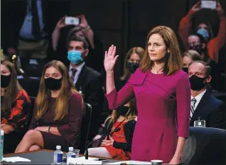  ?? DEMETRIUS FREEMAN VIA REUTERS ?? US Supreme Court nominee Amy Coney Barrett is sworn in during confirmati­on hearings before the Senate Judiciary Committee in Washington on Monday.