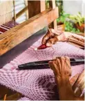  ?? ?? Master weaver's experience­d hands working on a binakol.